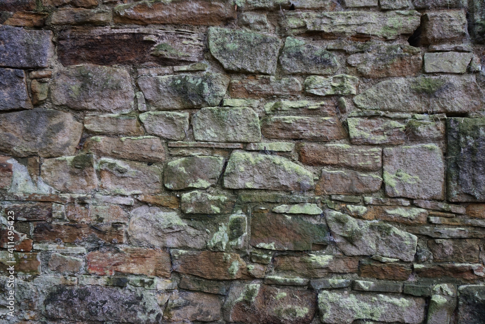 Old mixed size stones building wall close up Old mixed size stones building wall close up