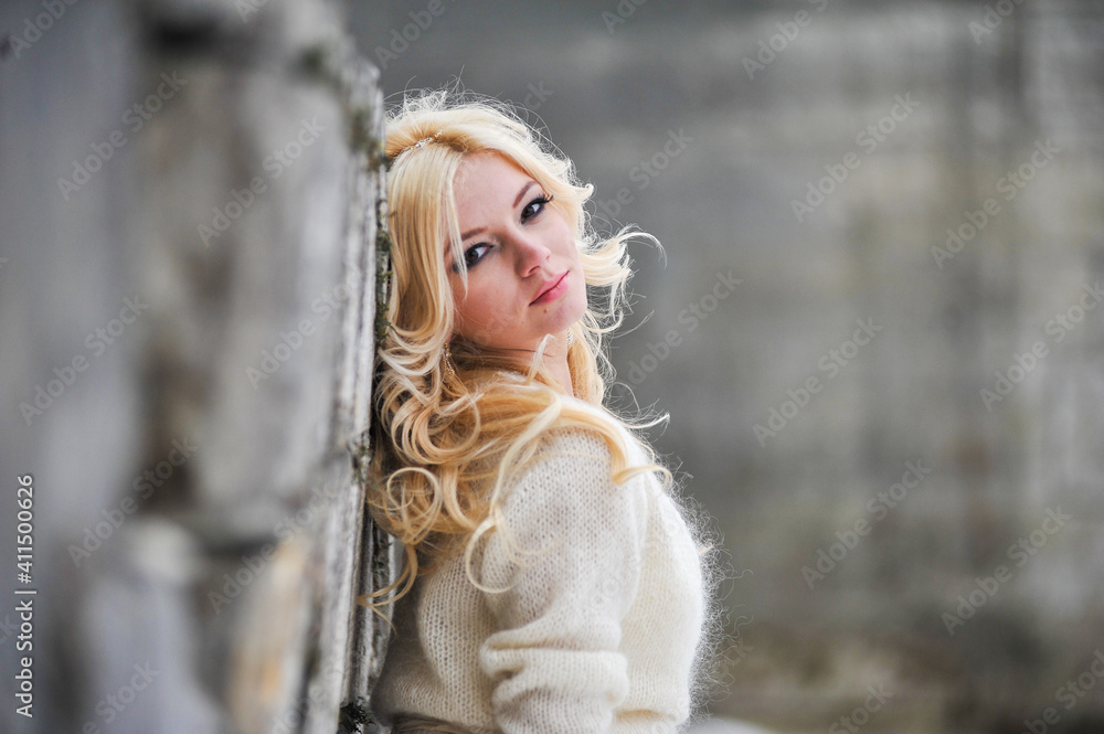 Beautiful bride near old castle on winter wedding day Beautiful bride near old castle on winter wedding day