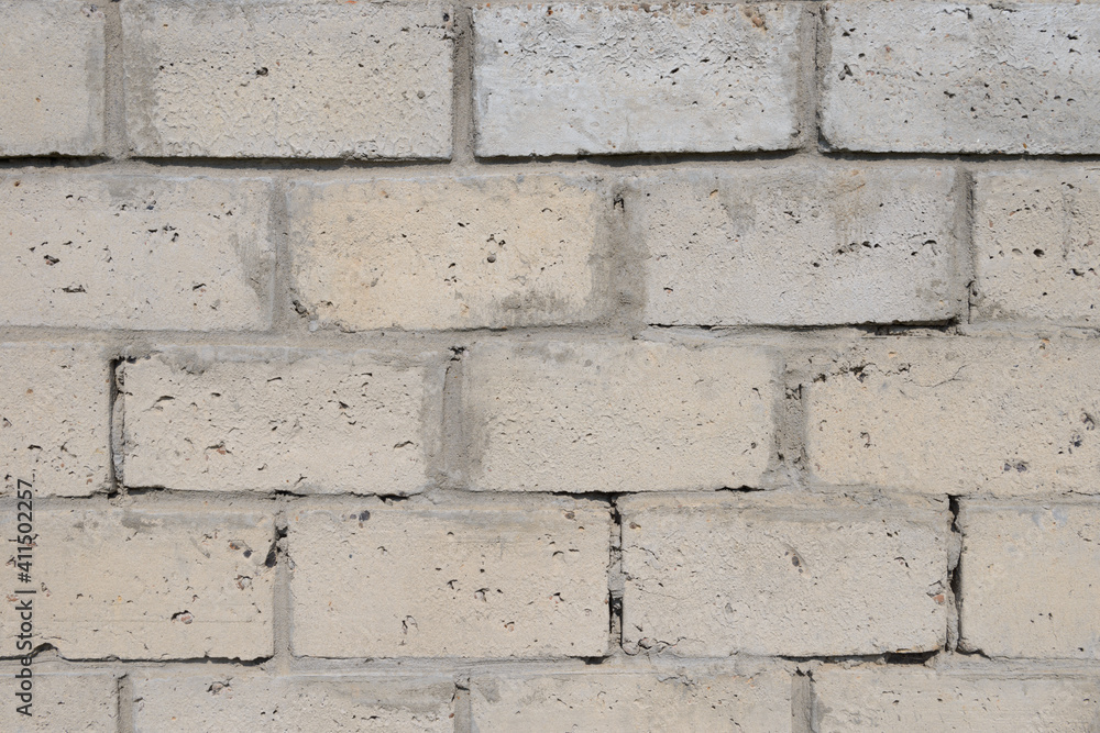 Fototapeta premium Brick wall made of gray cinder blocks