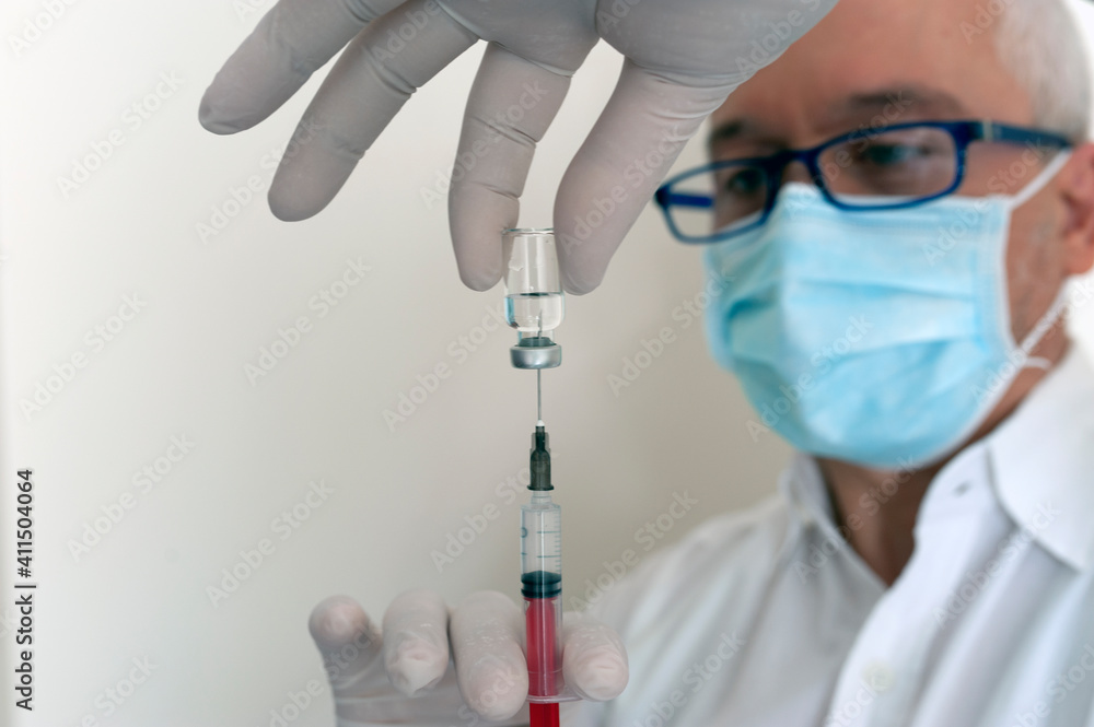 Doctor vaccinating, preparing vaccine Doctor vaccinating, preparing vaccine