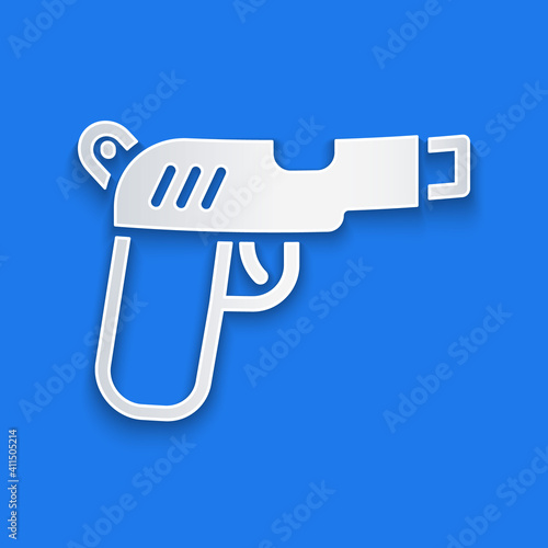 Paper cut Pistol or gun icon isolated on blue background. Police or military handgun. Small firearm. Paper art style. Vector.