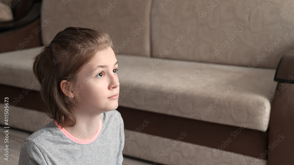 Teenage girl doing fitness exercise, practicing yoga at home. Healthy lifestyle concept. Workout at home. Home interior, natural light Teenage girl doing fitness exercise, practicing yoga at home. Healthy lifestyle concept. Workout at home. Home interior, natural light