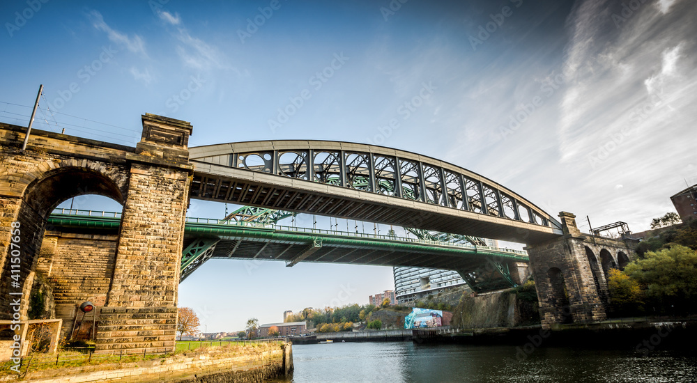 The Wearmouth bridge and the Monkwearmouth rail bridges sit side by side across the river Wear, Sunderland The Wearmouth bridge and the Monkwearmouth rail bridges sit side by side across the river Wear, Sunderland