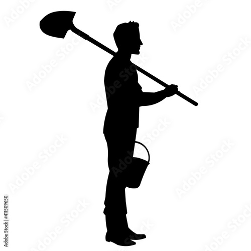Gardener farmer silhouette stands with a shovel and a garden bucket for planting