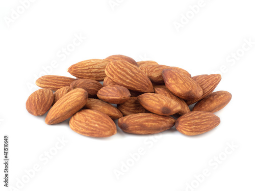 Heap of organic almonds isolated on white background for almond nuts can improve health concept .