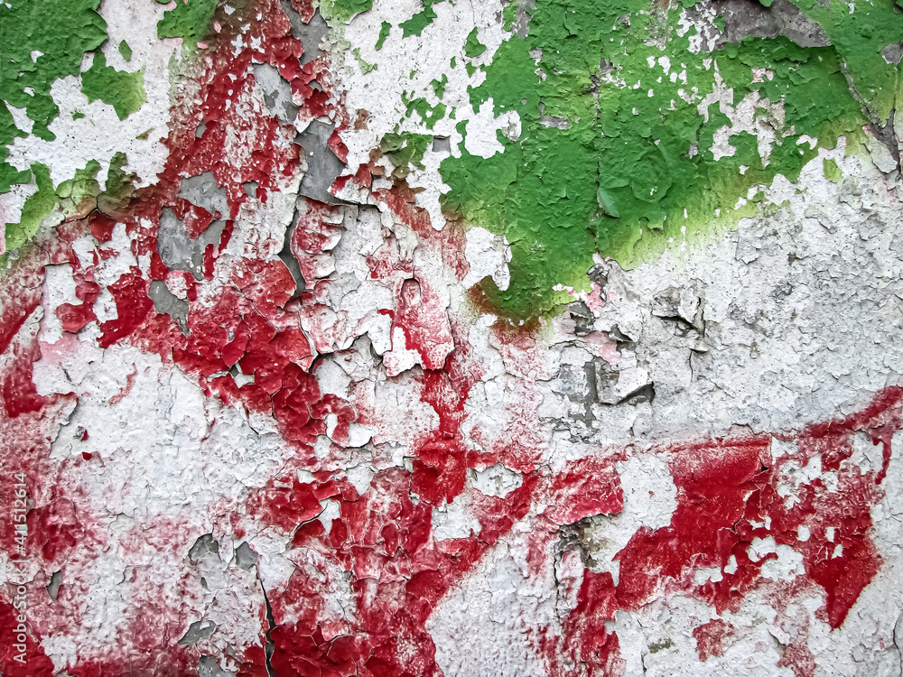 Fototapeta premium Red and green strokes on peeling old paint. White decay texture.