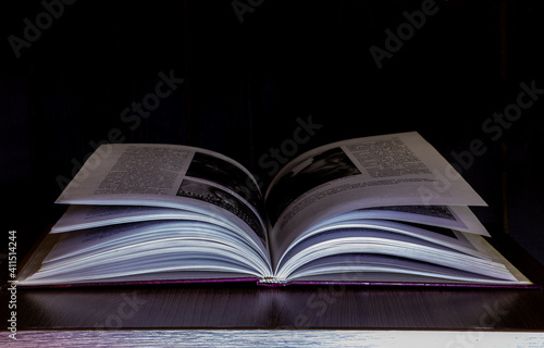 mysterious book on black background 