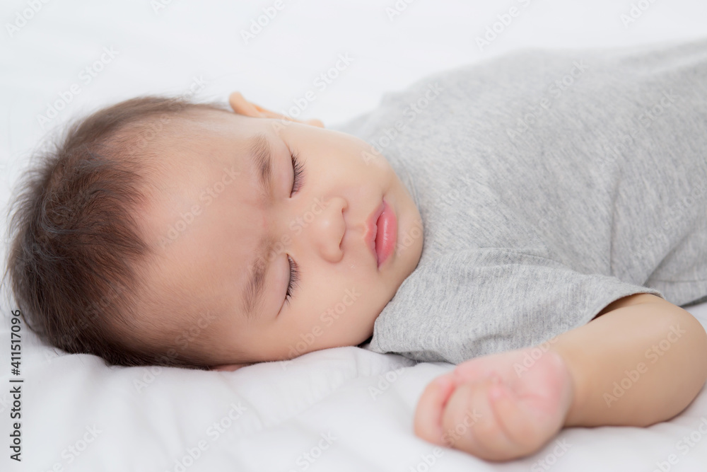 Portrait of asian little baby girl sleeping on bed in the bedroom at home, newborn napping with cozy and relax, infant innocence in bedtime, happy toddler cute, growth of child and emotion, indoors. Portrait of asian little baby girl sleeping on bed in the bedroom at home, newborn napping with cozy and relax, infant innocence in bedtime, happy toddler cute, growth of child and emotion, indoors.