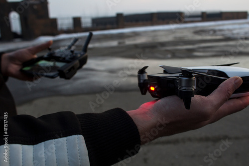 drone and remote control in human hands