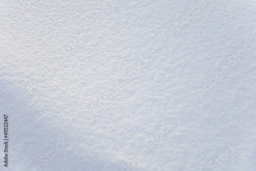 Background of fresh snow texture. Blue tone.