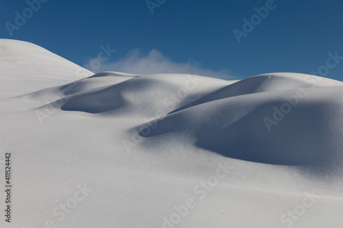 white dunes after a snowfall on the Cavalline hill in Elva, Valle Maira - Cottian Alps
