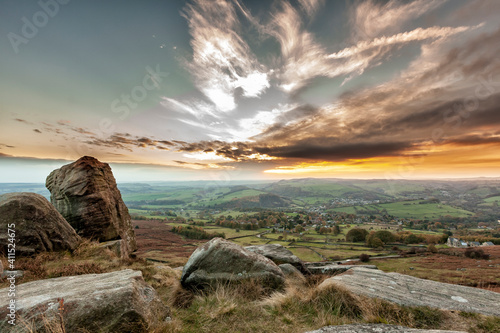 Sunset with moody clouds over Curbar Edge, Derbyshire, England