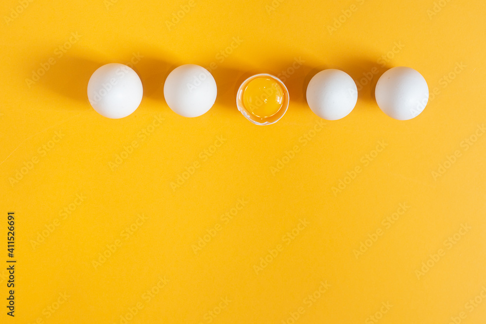 Chicken white eggs on a yellow background. Chicken white eggs on a yellow background.