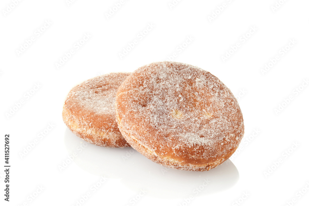 two paczki donuts on white