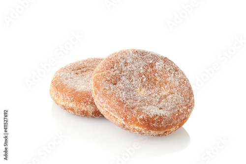 two paczki donuts on white