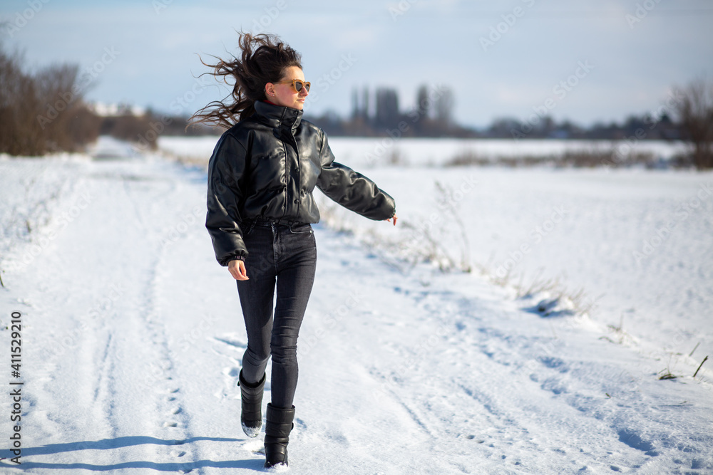 Woman runing in snow field