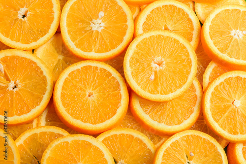 Texture of sliced orange  fresh and healthy fruit  which is rich in juice and vitamin c. Orange background.