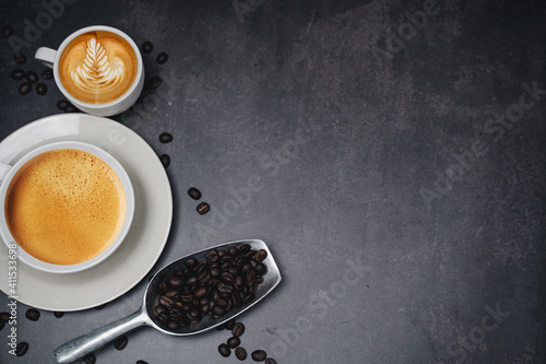 cup of coffee and Fresh baked croissant on old kitchen table. Top view with copyspace for your text.