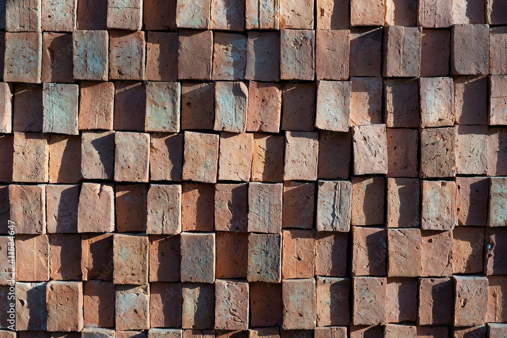 Old brown square brick wall Old brown square brick wall