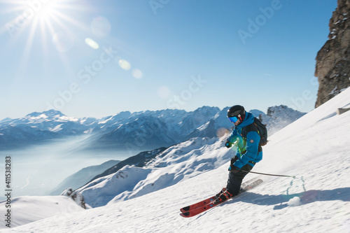 Skier with sunlight in Valmorel, Tarentaise Valley, French Alps photo