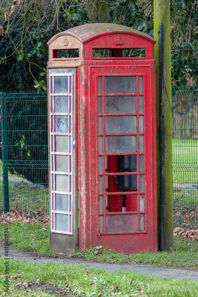 Old broken and smashed up red telephone box Old broken and smashed up red telephone box