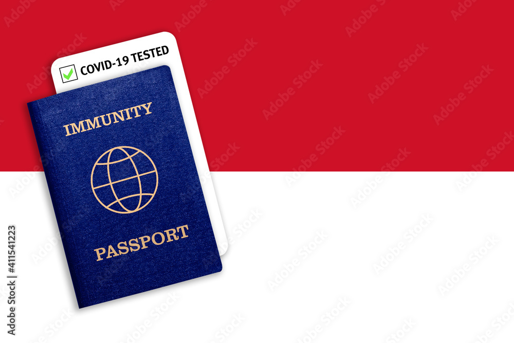Immunity passport and test result for COVID-19 on flag of Indonesia Immunity passport and test result for COVID-19 on flag of Indonesia