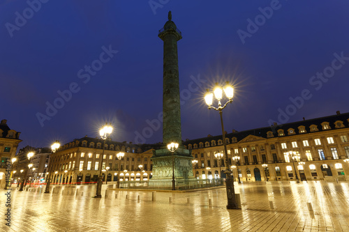 The Vendome column , the Place Vendome at rainy night, Paris, France.