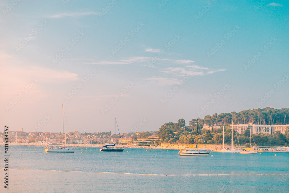 view of sunset in bay with yachts
