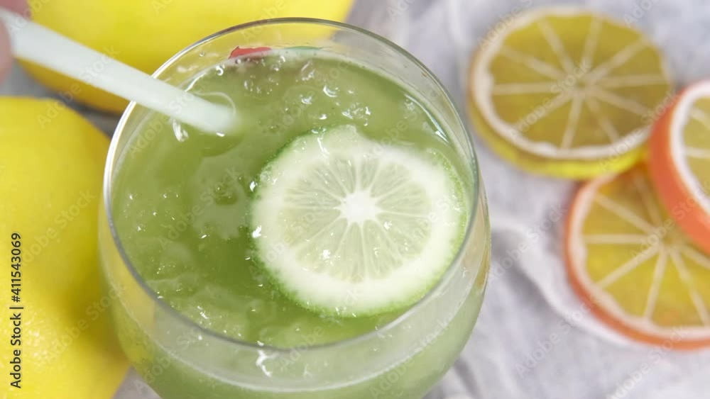 top view of fresh lime juice on table top view of fresh lime juice on table