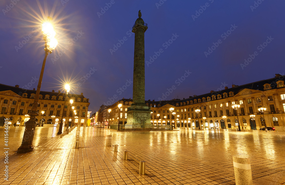 The Vendome column , the Place Vendome at rainy night, Paris, France.