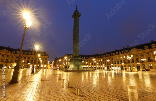 The Vendome column , the Place Vendome at rainy night, Paris, France. © kovalenkovpetr