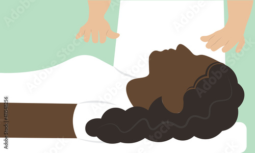 Calm young woman receiving reiki healing treatment