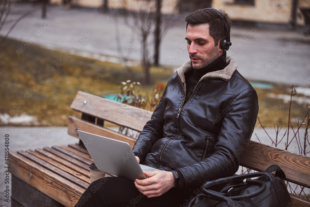 Businessman taking part in online conference outdoors Businessman taking part in online conference outdoors