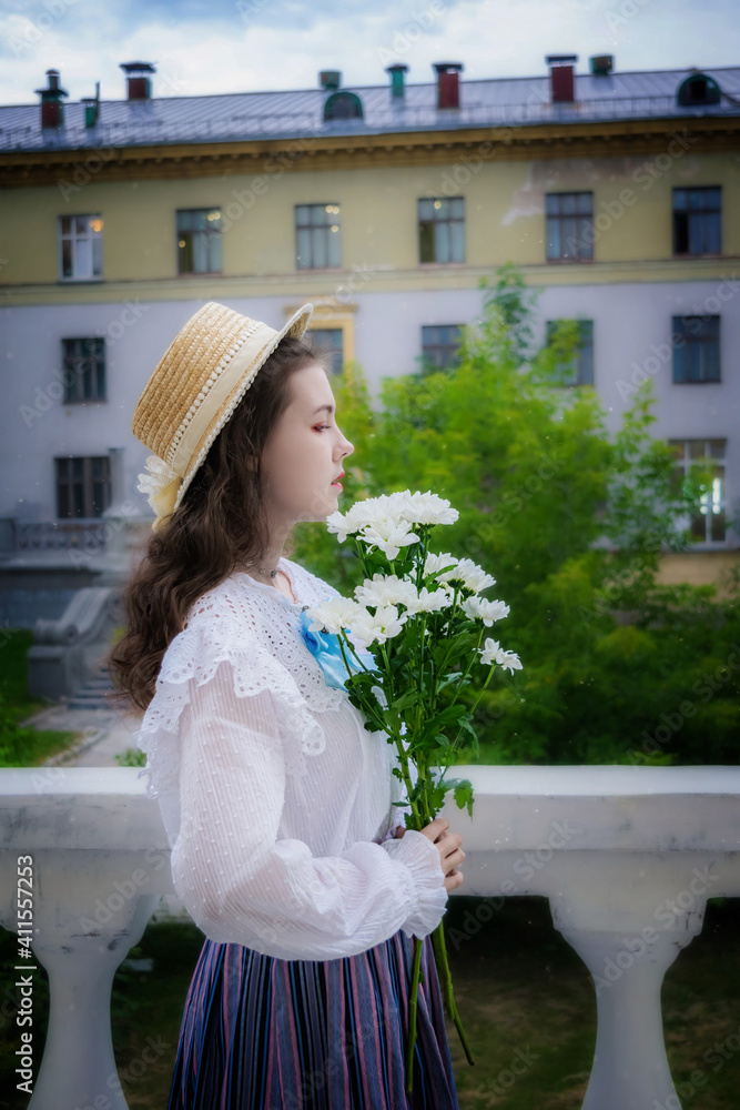 Portrait girl with a bouquet of white chrysanthemums in an vintage clothes Portrait girl with a bouquet of white chrysanthemums in an vintage clothes