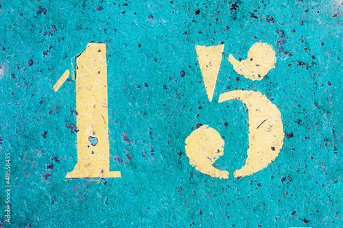 number 15 on a colored concrete floor