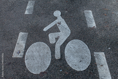 white bicycle markings on grey asphalt