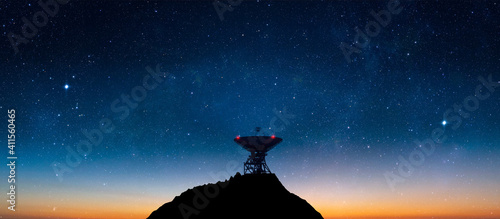Landscape with signal receiving radio telescope in starry night sky - 3d Illustration photo