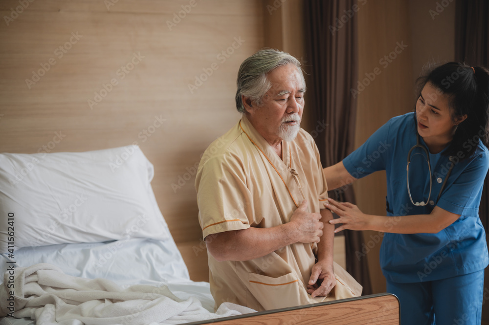 Fototapeta premium Nurses support the elderly patient man to resting at hospital room, medical health care and old disease insurance concept