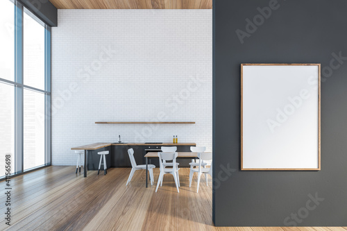 Modern kitchen interior with copy space on red brick wall, wooden countertops with a built in sink and a cooker. Mock up. Loft apartment dining room area. Front poster on grey wall. photo