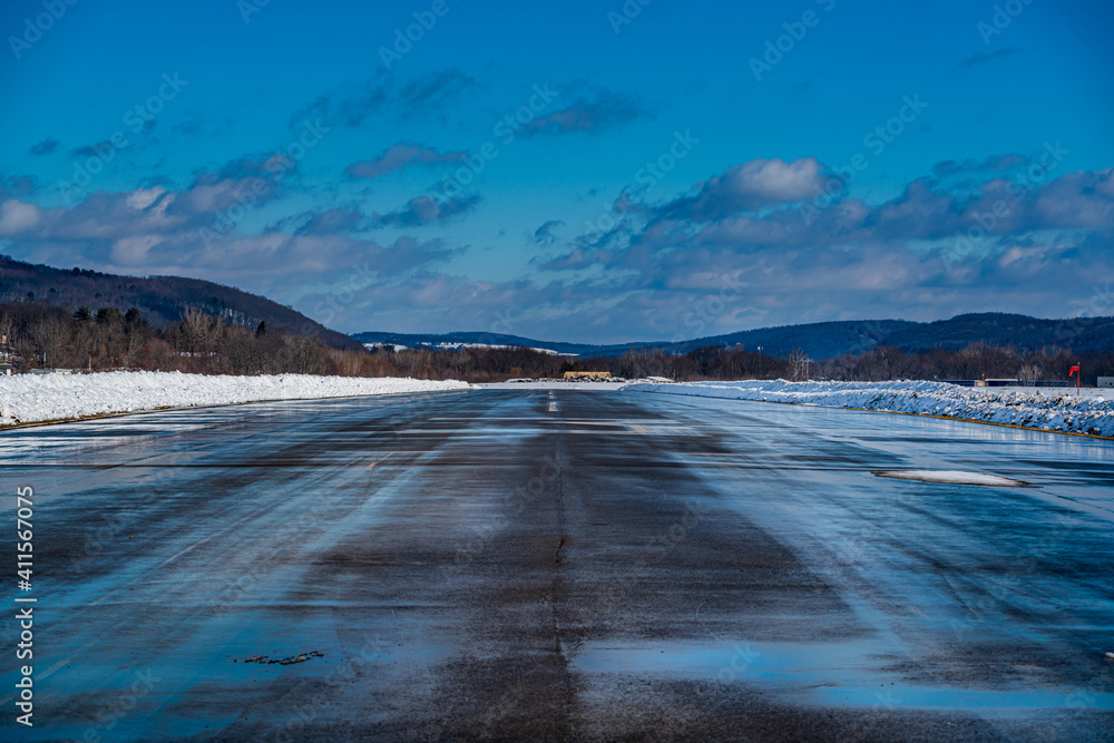 Airport Runway landscape with snow and mountains