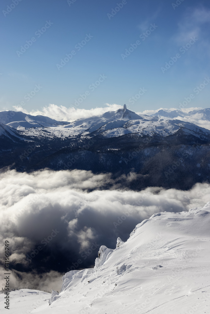 Beautiful Aerial View of Black Tusk and Canadian Nature Landscape covered in Snow during winter. Taken on top of Whistler Mountain, British Columbia, Canada. Nature Background