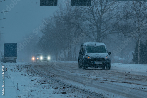 Cars driving in the snowstorm, cars driving in the snow, cars on a snow-covered street, Berlin, Germany