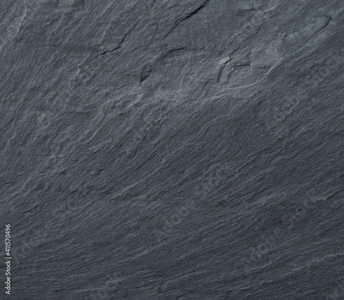 Textura de superfície de laje - pedra de lousa com relevos e linhas ritmadas do canto inferior esquerdo a abrir para o centro  photo
