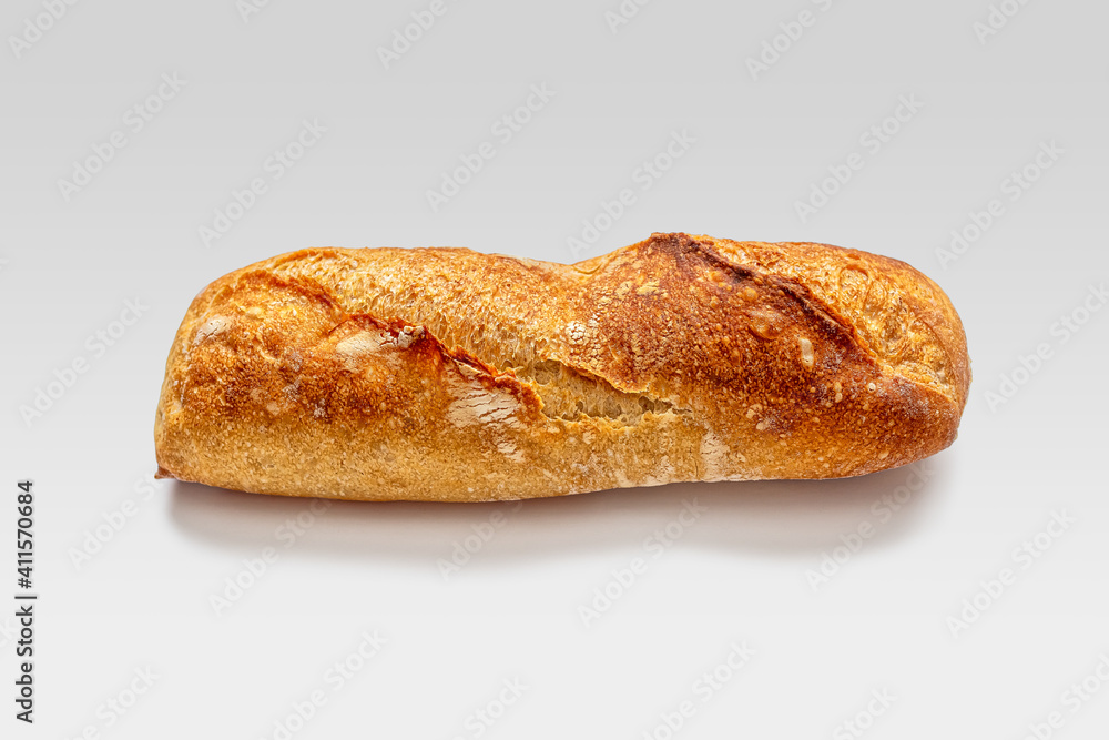 Small mini baguette with slits on a crisp golden crust