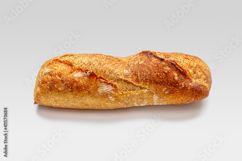 Small mini baguette with slits on a crisp golden crust
