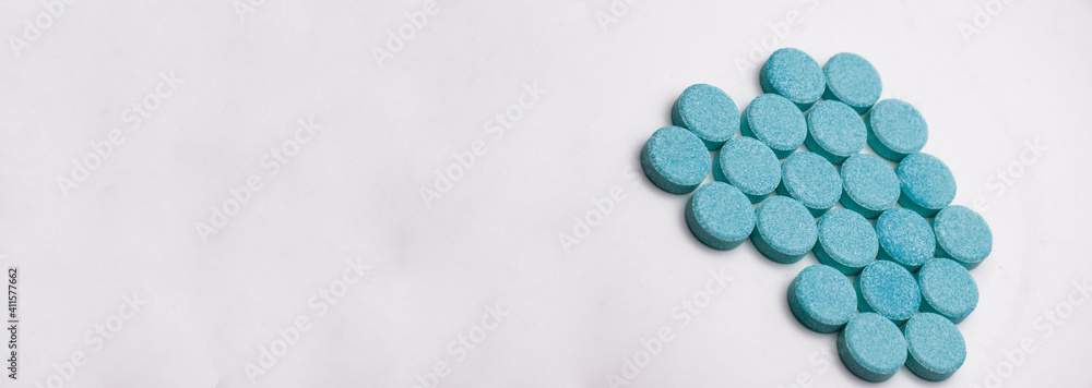 pills on a gray background. medicinal capsules on the table. treatment concept. many vitamins