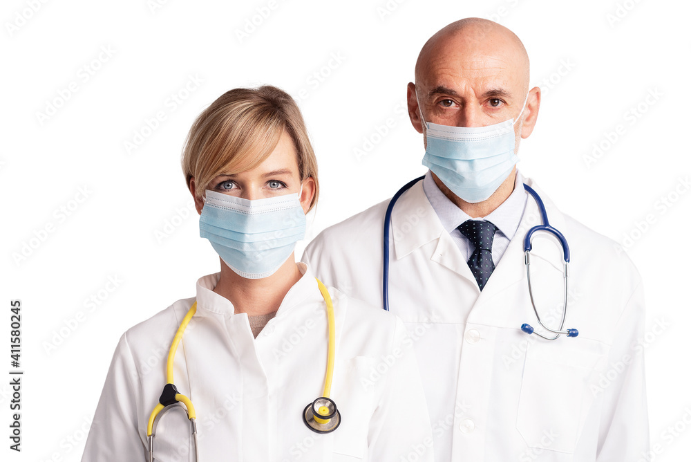 Medical team wearing face masks while standing at isolated white background Medical team wearing face masks while standing at isolated white background