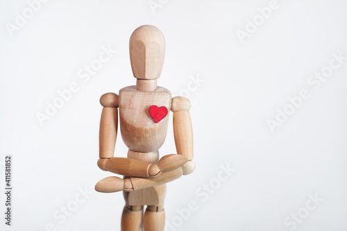 wooden mannequin with a heart