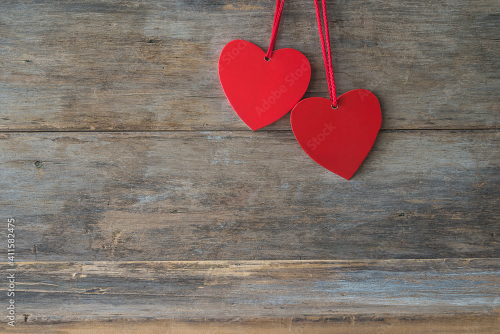 Valentine card background. Two red hearts on wooden background. Space for space Valentine card background. Two red hearts on wooden background. Space for space