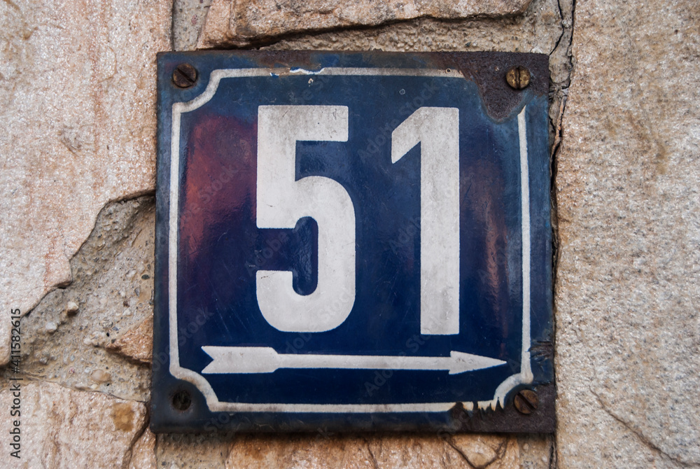Weathered grunge square metal enamelled plate of number of street address with number 51 Weathered grunge square metal enamelled plate of number of street address with number 51